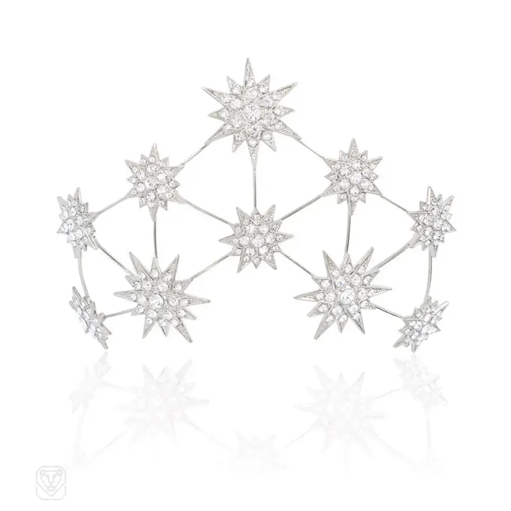 A Swarovski crystal hair slide of starburst motifs, in palladium-plated bronze.  Andrew Prince.