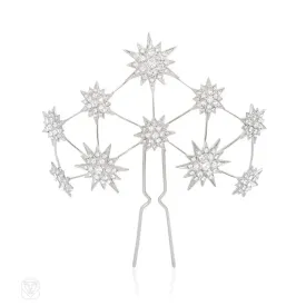 A Swarovski crystal hair slide of starburst motifs, in palladium-plated bronze.  Andrew Prince.